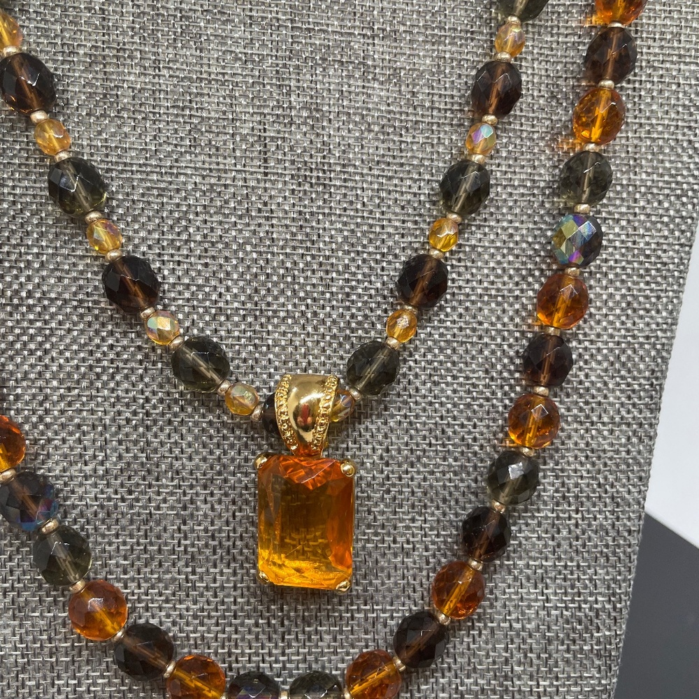 Joan Rivers bead necklaces and enhancer pendant in amber